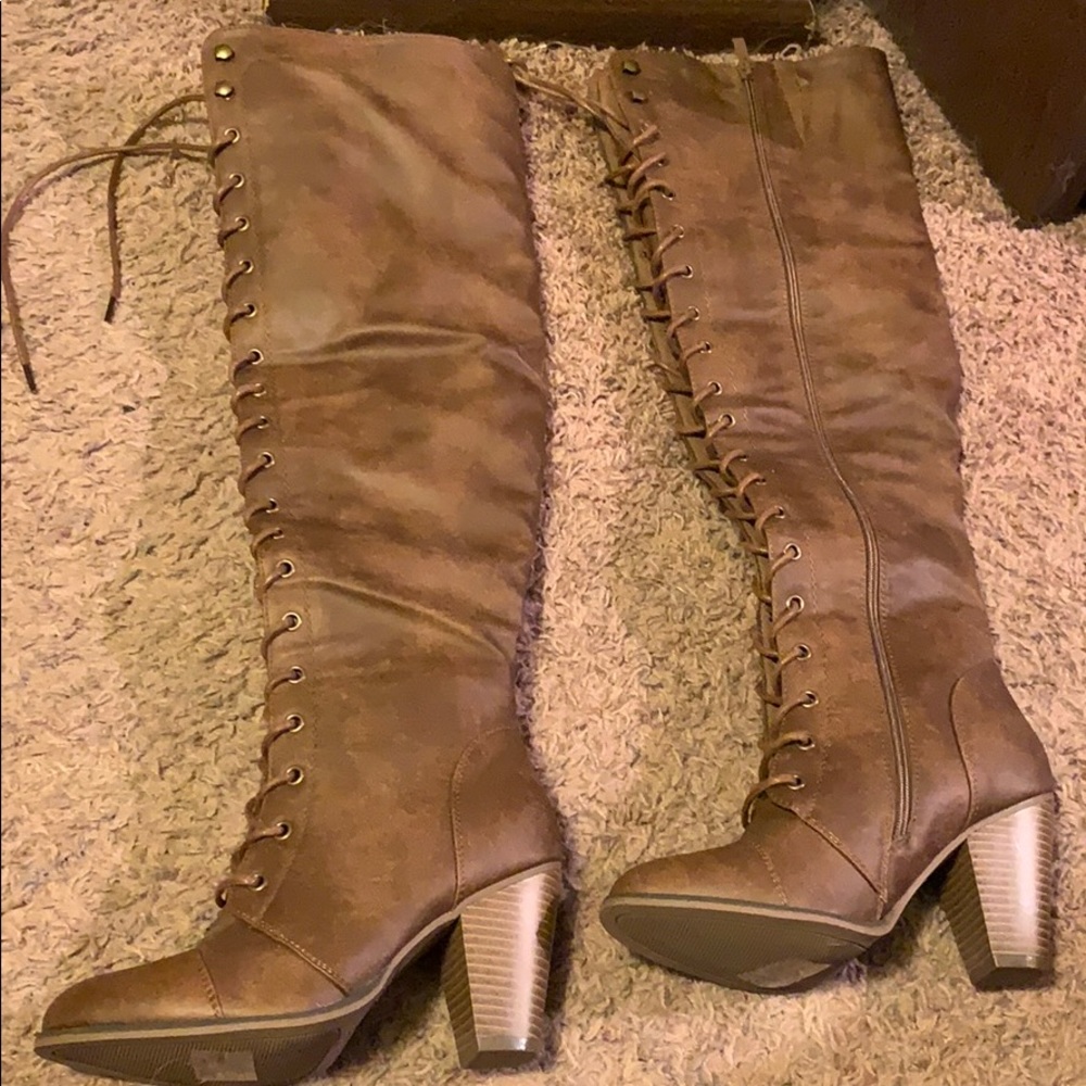 Knee high heeled lace up brown boots